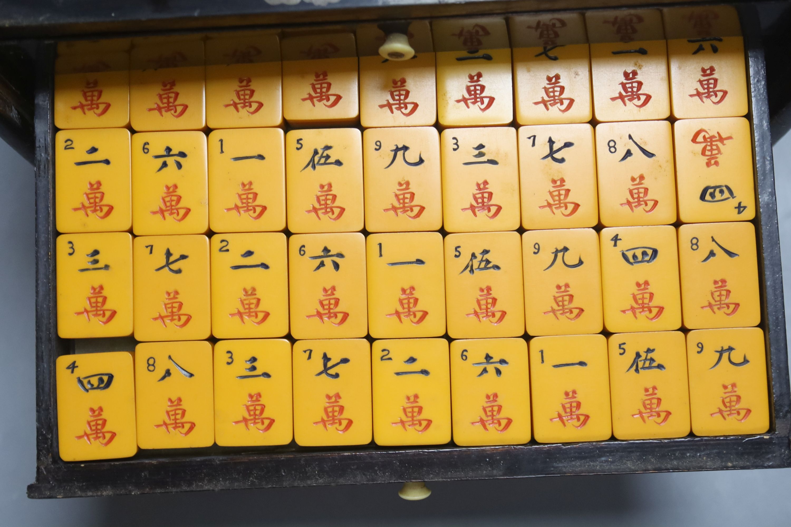 A Chinese lacquer cased Mah Jong set